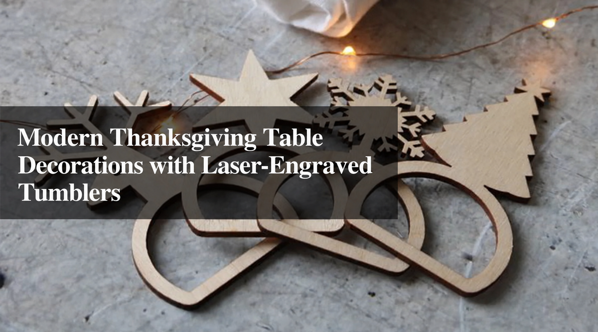 Laser-cut wooden holiday decorations featuring stars, snowflakes, and a Christmas tree arranged on a gray tabletop with warm string lights.